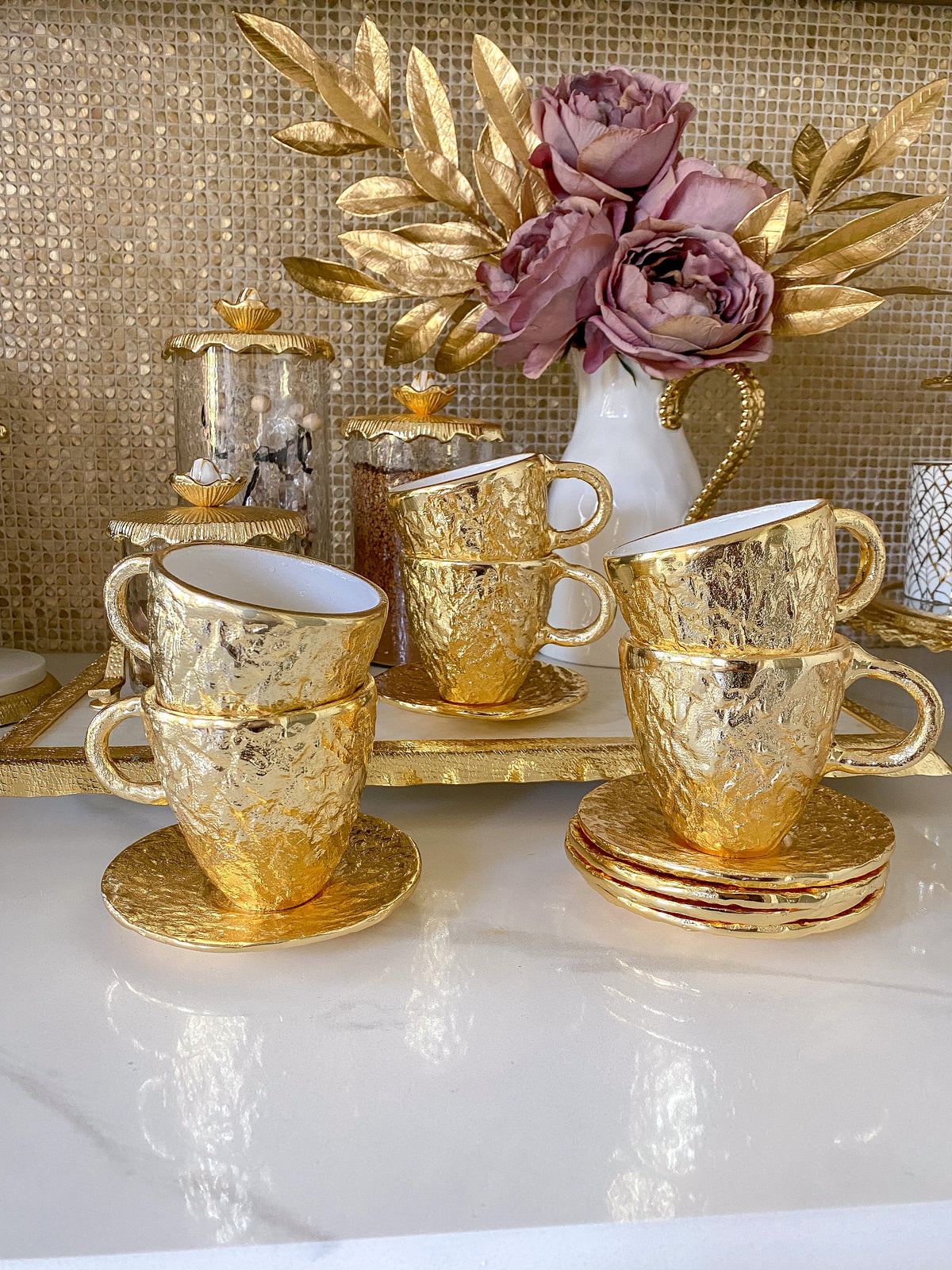 https://www.shopinspiremehomedecor.shop/wp-content/uploads/1693/26/gold-textured-metal-tea-cup-and-saucer-with-white-interior-inspire-me-home-decor-explore-a-world-of-possibilities-take-a-look-at-our-extensive-selection_0.jpg
